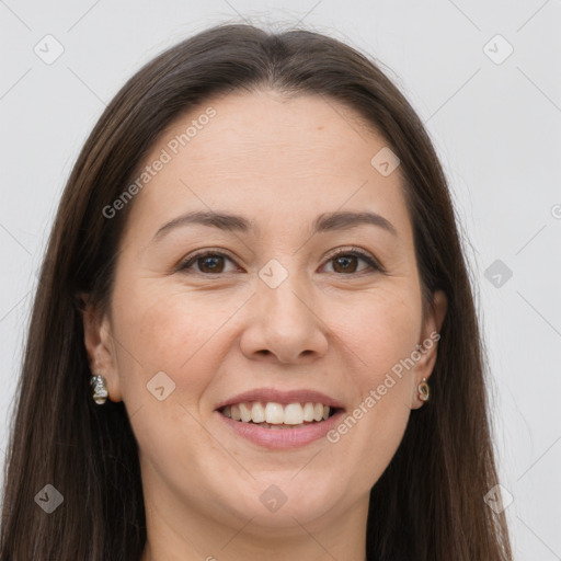 Joyful white adult female with long  brown hair and brown eyes