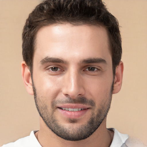 Joyful white young-adult male with short  brown hair and brown eyes