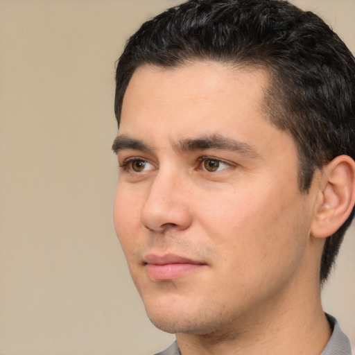 Neutral white young-adult male with short  black hair and brown eyes
