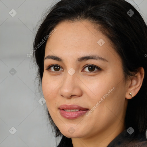 Joyful latino young-adult female with medium  brown hair and brown eyes