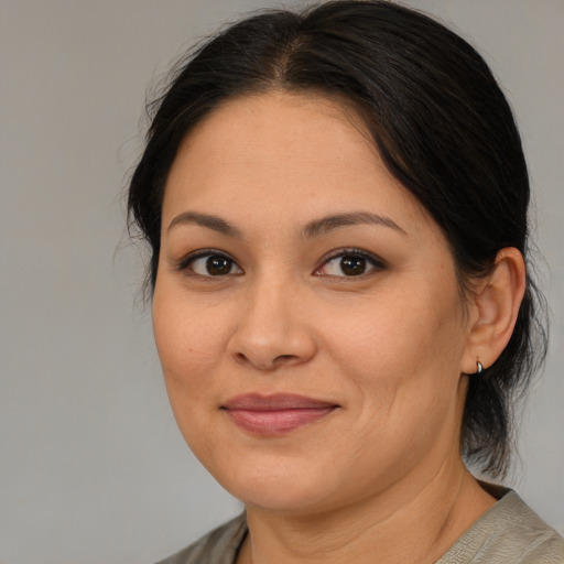 Joyful asian young-adult female with medium  brown hair and brown eyes