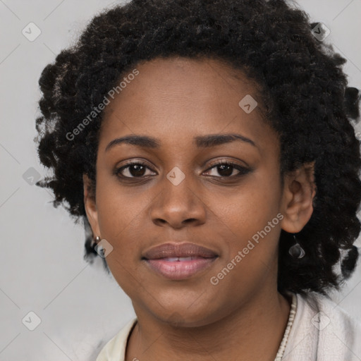 Joyful black young-adult female with long  black hair and brown eyes