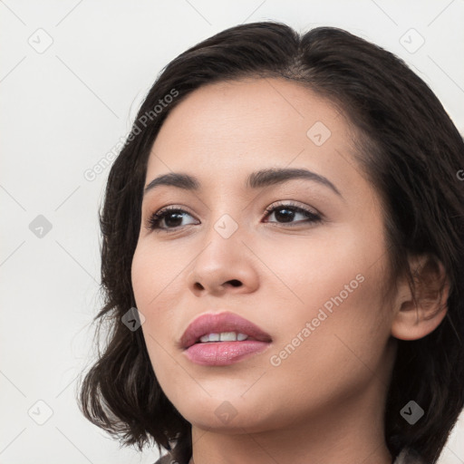 Joyful white young-adult female with long  black hair and brown eyes