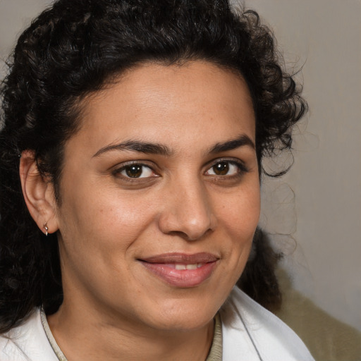 Joyful white adult female with medium  brown hair and brown eyes