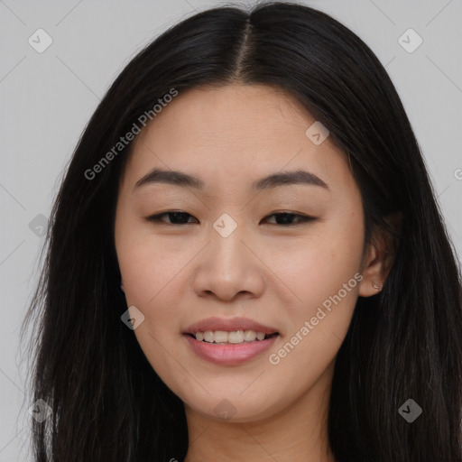 Joyful asian young-adult female with long  brown hair and brown eyes