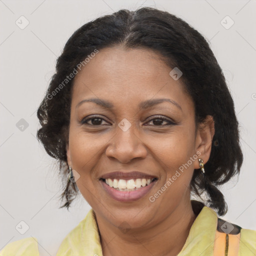 Joyful black adult female with medium  brown hair and brown eyes