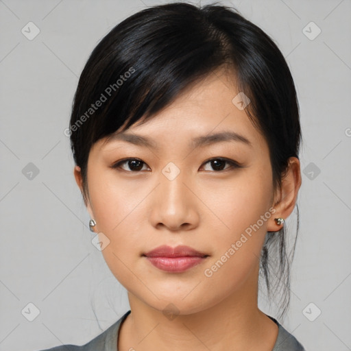 Neutral asian young-adult female with medium  black hair and brown eyes