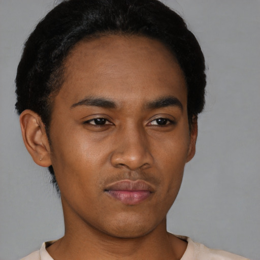 Neutral black young-adult male with short  black hair and brown eyes