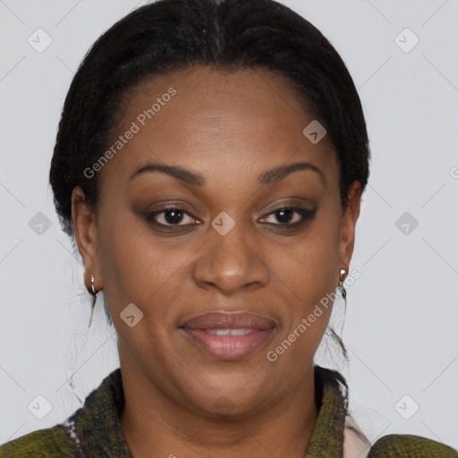 Joyful black adult female with short  brown hair and brown eyes