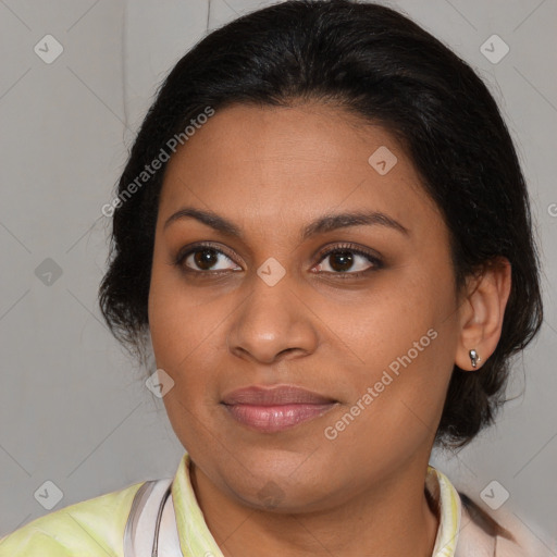 Joyful latino young-adult female with medium  brown hair and brown eyes