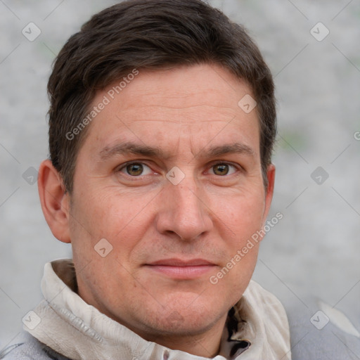 Joyful white adult male with short  brown hair and grey eyes