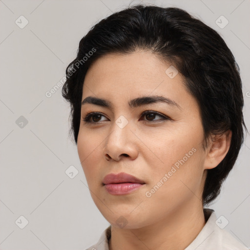 Joyful asian young-adult female with medium  brown hair and brown eyes