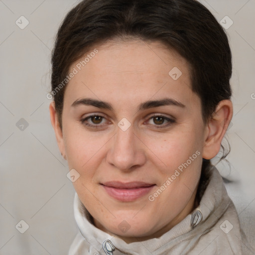 Joyful white adult female with short  brown hair and brown eyes