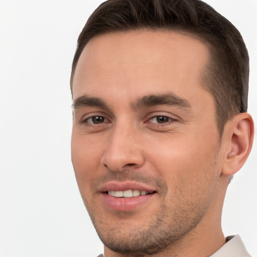 Joyful white young-adult male with short  brown hair and brown eyes