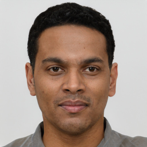 Neutral black young-adult male with short  black hair and brown eyes