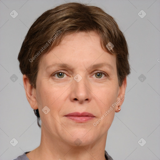 Joyful white adult female with short  brown hair and grey eyes