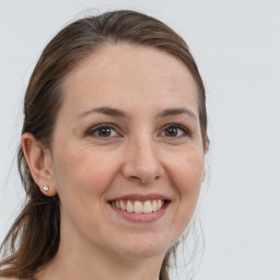 Joyful white young-adult female with medium  brown hair and brown eyes