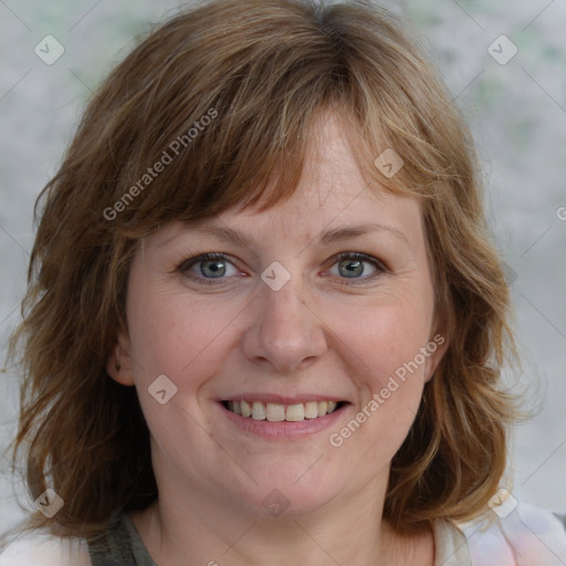 Joyful white young-adult female with medium  brown hair and blue eyes