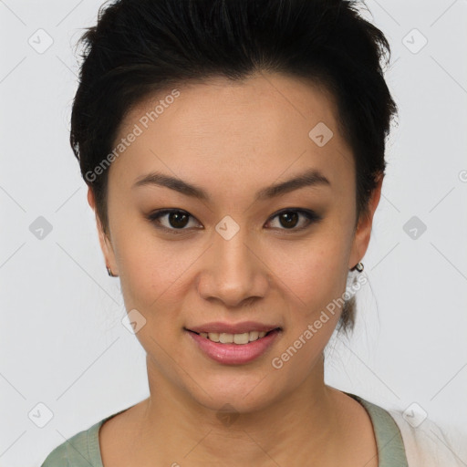 Joyful asian young-adult female with short  black hair and brown eyes