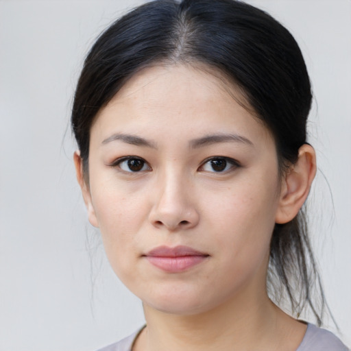 Neutral asian young-adult female with medium  brown hair and brown eyes