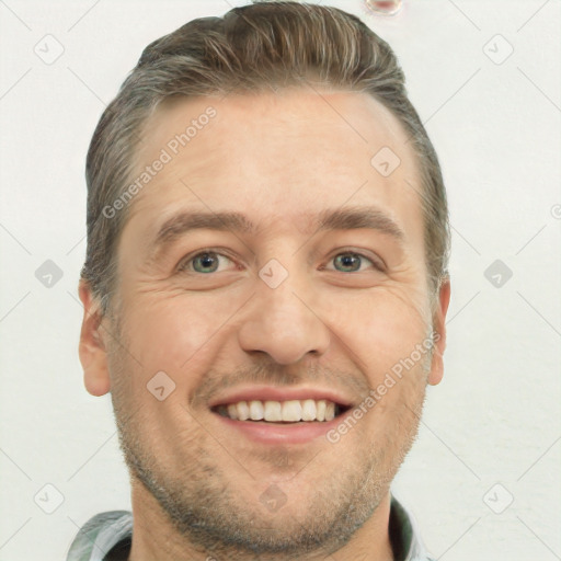 Joyful white adult male with short  brown hair and brown eyes