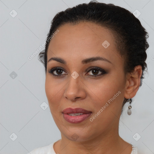 Joyful latino young-adult female with short  brown hair and brown eyes