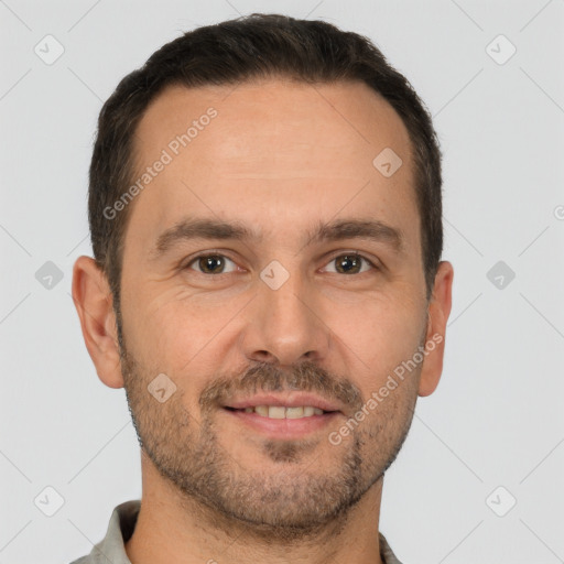 Joyful white adult male with short  brown hair and brown eyes