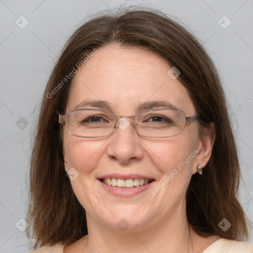 Joyful white adult female with medium  brown hair and grey eyes