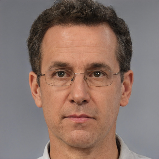 Neutral white middle-aged male with short  brown hair and brown eyes