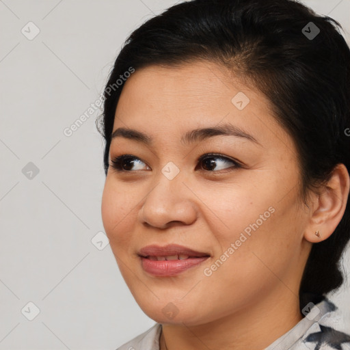 Joyful asian young-adult female with medium  brown hair and brown eyes