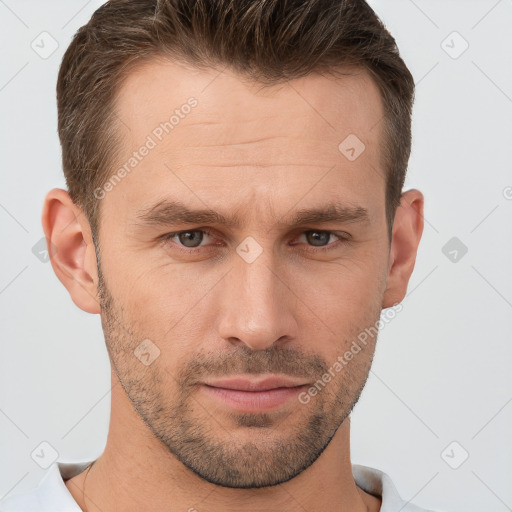 Joyful white adult male with short  brown hair and brown eyes