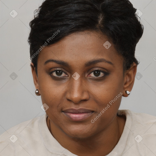 Joyful black young-adult female with short  brown hair and brown eyes