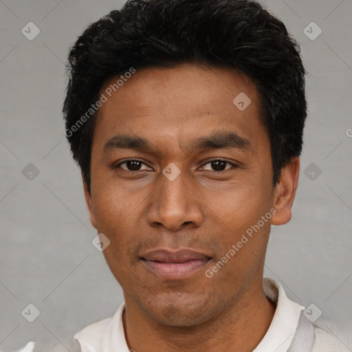 Joyful latino adult male with short  black hair and brown eyes