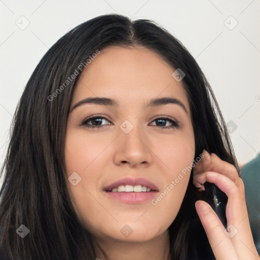 Joyful white young-adult female with long  black hair and brown eyes