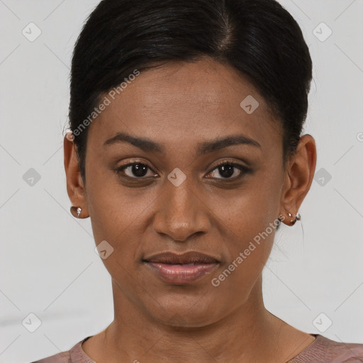 Joyful black young-adult female with short  black hair and brown eyes