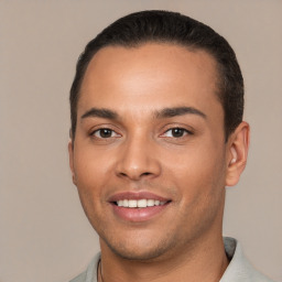 Joyful white young-adult male with short  black hair and brown eyes