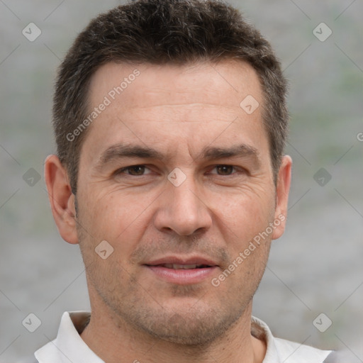 Joyful white adult male with short  brown hair and brown eyes