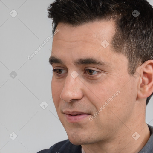 Joyful white adult male with short  brown hair and brown eyes