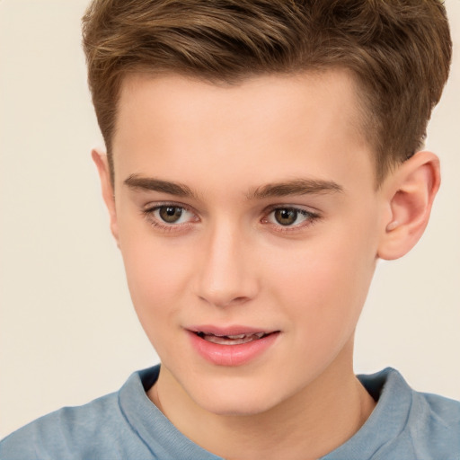 Joyful white child male with short  brown hair and brown eyes