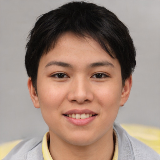 Joyful asian young-adult female with short  brown hair and brown eyes
