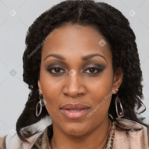 Joyful black young-adult female with long  brown hair and brown eyes