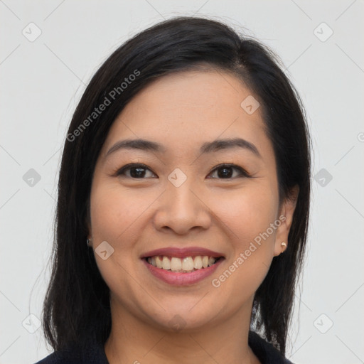 Joyful asian young-adult female with long  brown hair and brown eyes