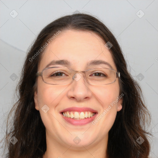 Joyful white adult female with long  brown hair and brown eyes