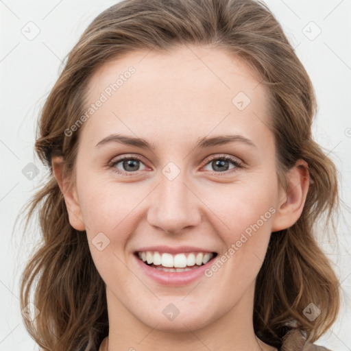 Joyful white young-adult female with medium  brown hair and green eyes