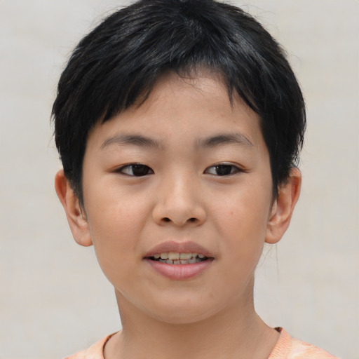 Joyful asian child female with short  brown hair and brown eyes