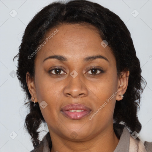 Joyful black adult female with medium  brown hair and brown eyes