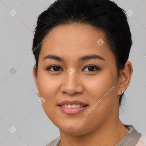 Joyful asian young-adult female with short  brown hair and brown eyes