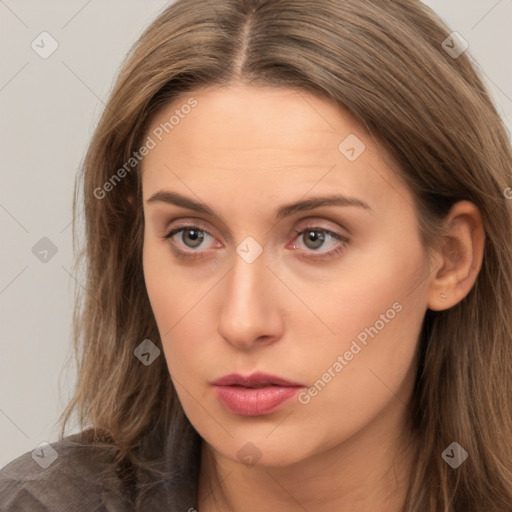 Neutral white young-adult female with long  brown hair and brown eyes