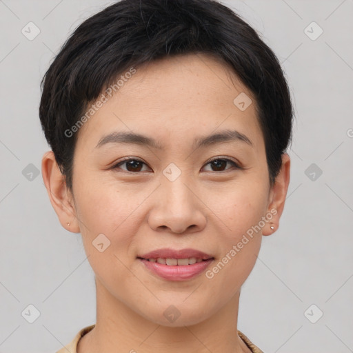 Joyful asian young-adult female with short  brown hair and brown eyes