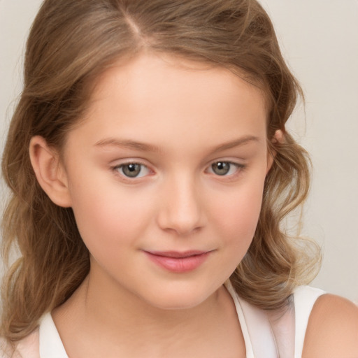 Joyful white child female with medium  brown hair and brown eyes